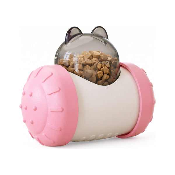 Pink treat dispensing wobbler dog toy with clear dome filled with kibble