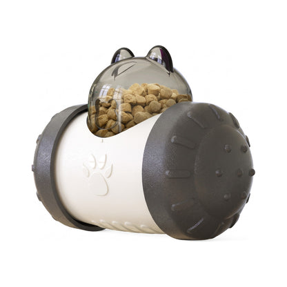 Black treat dispensing wobbler dog toy with clear dome filled with kibble