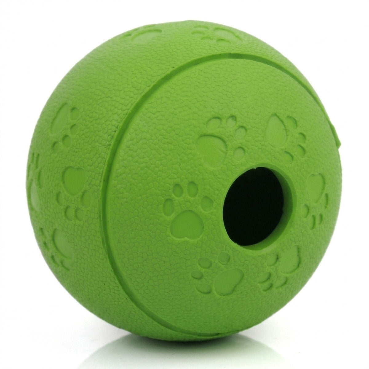 Close up of the treat dispensing dog ball showing the round opening, pebbled grip texture and paw prints