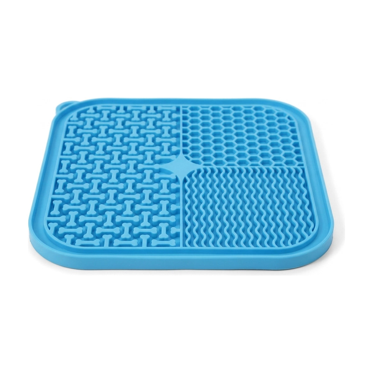 Close-up of the blue dog lick mat showing raised bone shapes, honeycomb cells, wavy ridges and raised rim