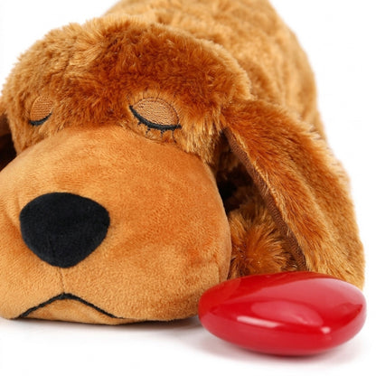 Close-up of the heartbeat puppy plush face with embroidered sleeping eyes, fabric nose and red heart insert