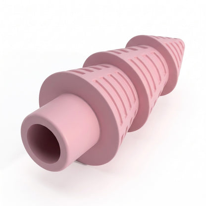 Close up of the moulded grooves and hollow trunk of the pink Christmas tree chew toy