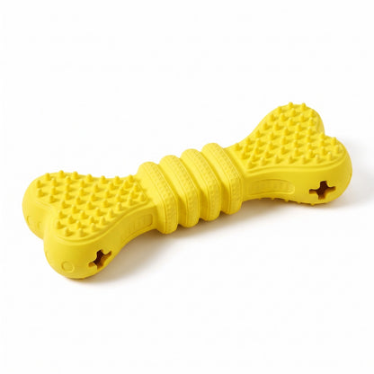 Yellow treat dispensing chew bone, rubber dog chew toy with nubbed ends and kibble holes