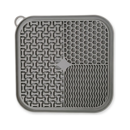 Grey silicone dog lick mat with suction cups, textured bone, honeycomb and wave pattern