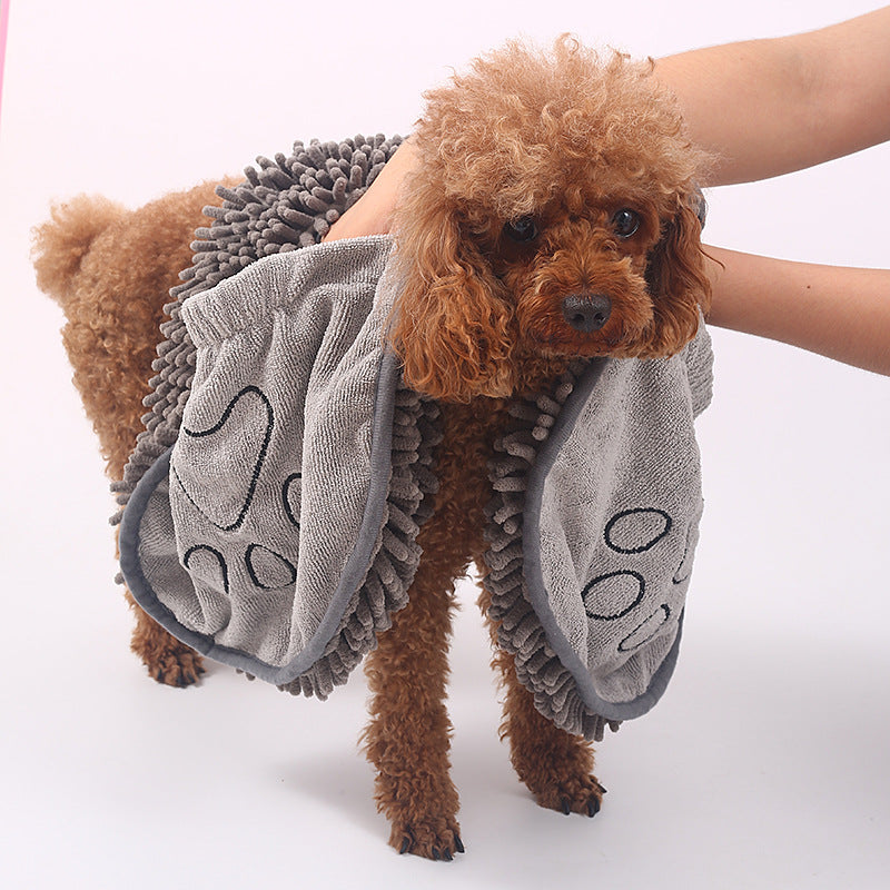 Drying a dog with the chenille towel using the hand pockets