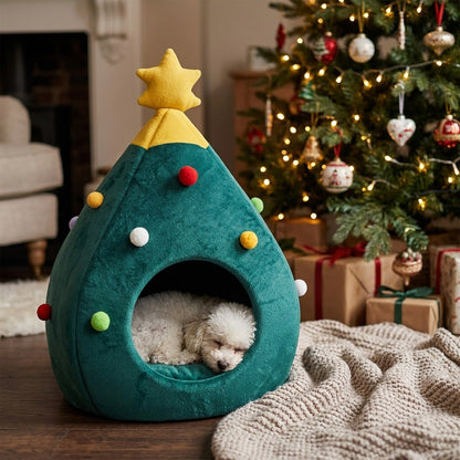Toy Poodle asleep in the Dome Christmas tree bed by the Christmas tree