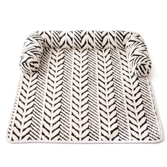 Monochrome dog bed mat on a white background