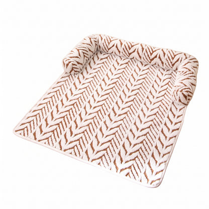 Tan dog bed mat on a white background