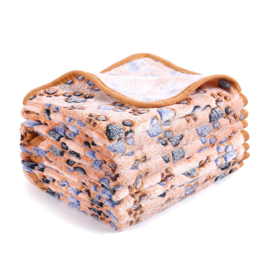Camel fleece dog blanket with blue and brown paw prints