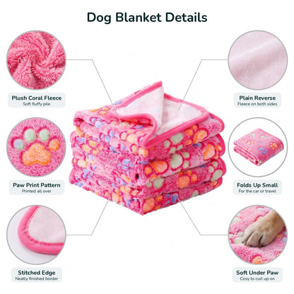 Dog blanket details: plush coral fleece, paw print pattern, stitched edge, plain reverse, folds up small