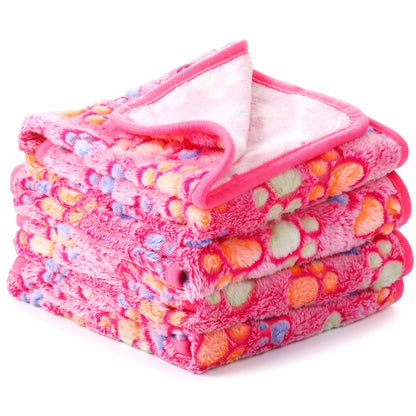Hot pink fleece dog blanket with pastel paw prints