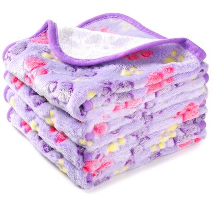 Lilac fleece dog blanket with pink and yellow paw prints