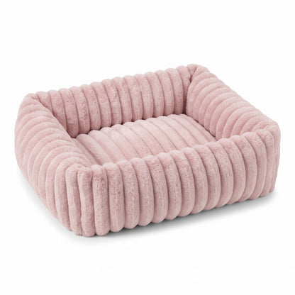 Blush Pink fluffy dog bed on a white background