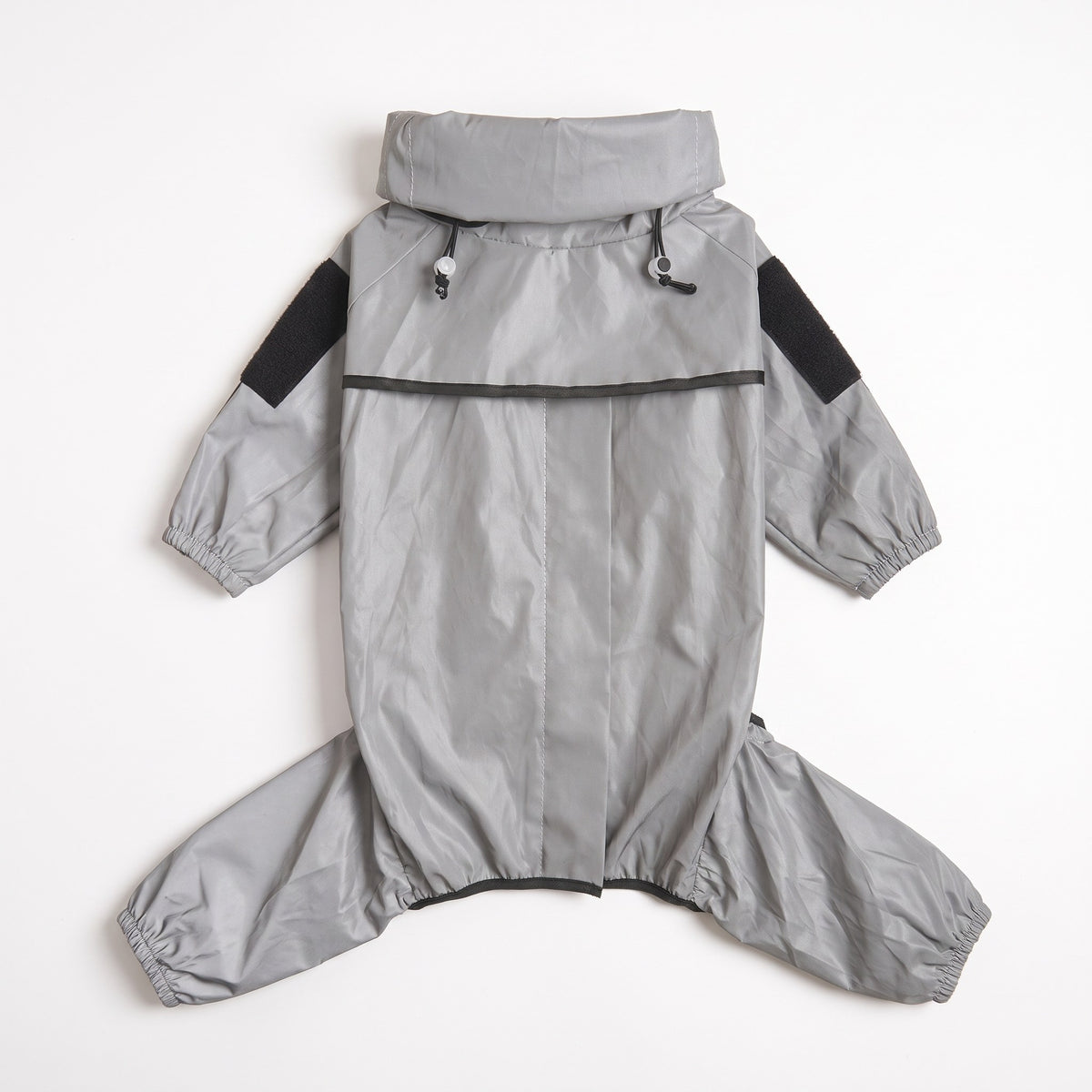 Full-body reflective dog rain suit laid flat showing collar, drawcord toggles and four elasticated legs