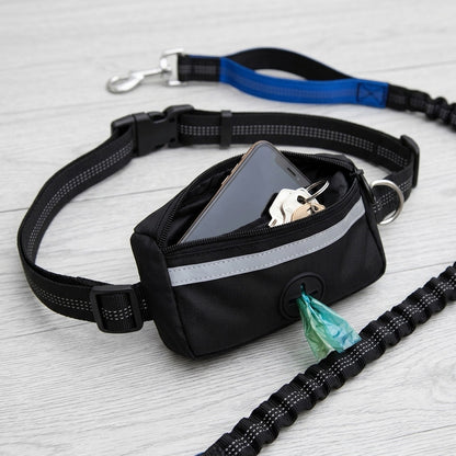 Waist bag of the hands free dog lead with open zipped pockets holding a phone, keys and poo bags