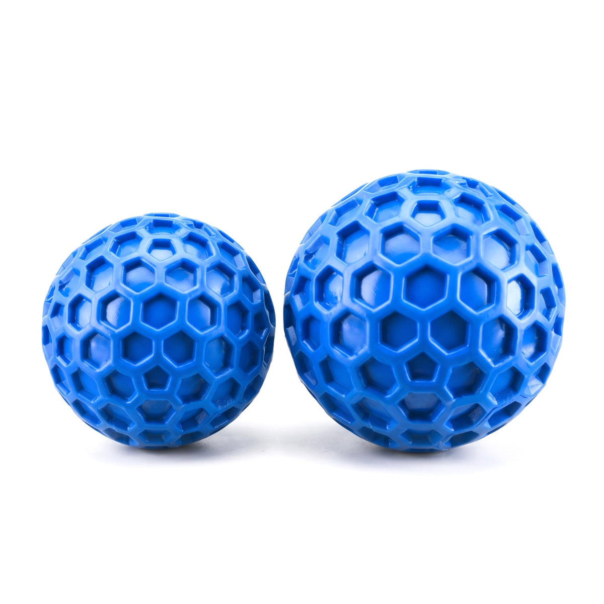 Small and large blue honeycomb squeaky dog balls side by side