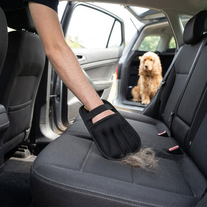 Removing dog hair from a car seat with the pet hair remover glove