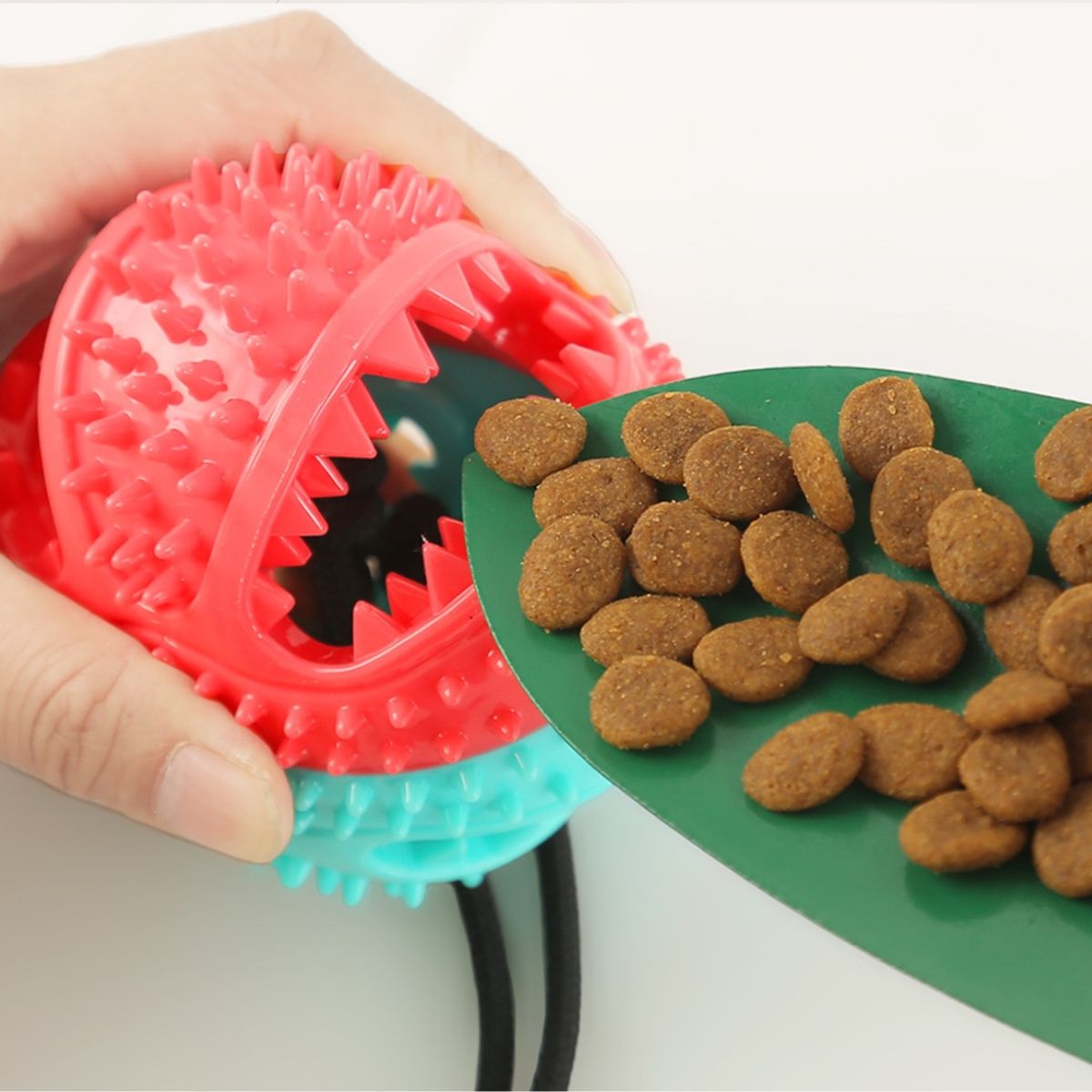 Dog ball with outlet treats inside